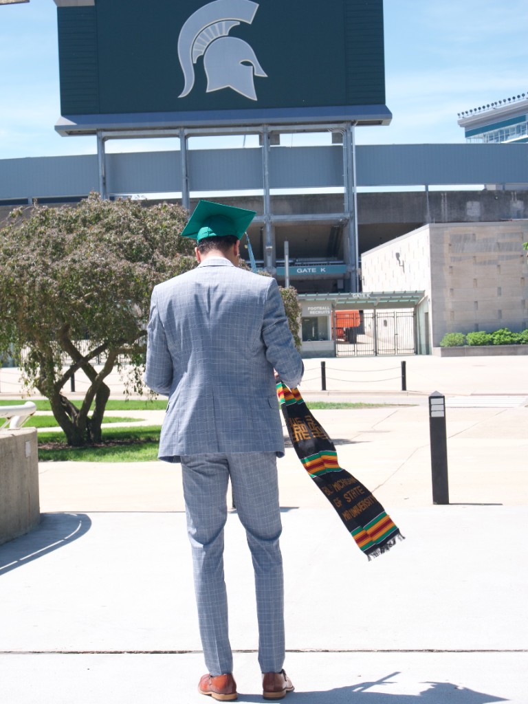 Graduate in front of Michigan State stadium